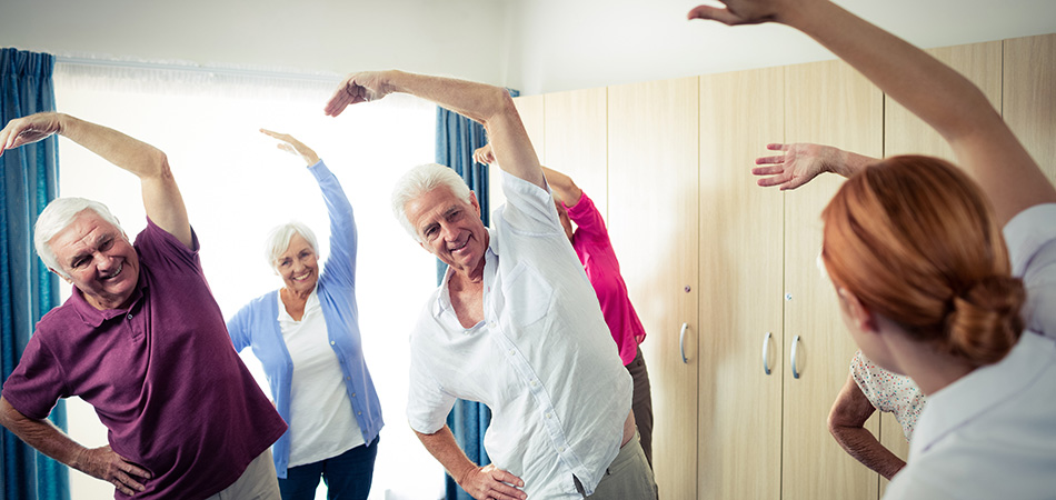 Seniors stretching in exercise class