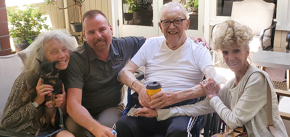 Doug Hawkins, RN visiting our resident and his beautiful family