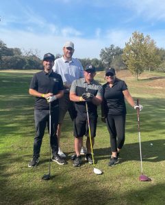 Asbury staff at a golf tournament