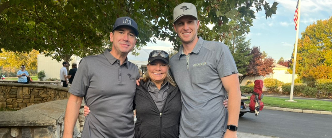 three members of Asbury staff at Play It Forward Charity Golf Tournament
