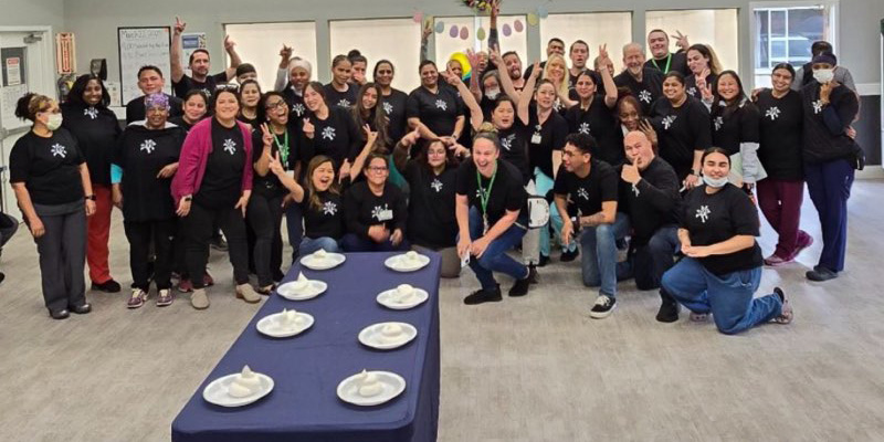 Fun Friday caregivers playing some games including pie eating